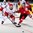 MINSK, BELARUS - MAY 11: Switzerland's Damien Brunner #96 and Belarus' Vladimir Denisov #7 chase down a loose puck during preliminary round action at the 2014 IIHF Ice Hockey World Championship. (Photo by Andre Ringuette/HHOF-IIHF Images)

